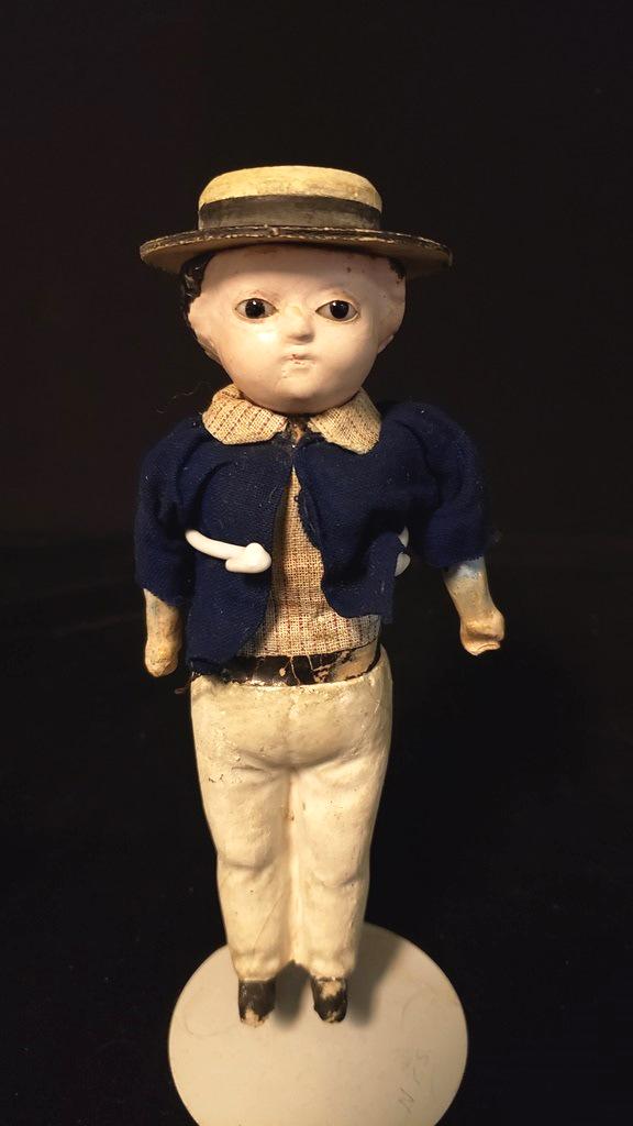 Composition Squeak Doll: Composition Squeak Doll with Hat and Jacket, all molded , his eyes are glass, and he works 7 1/2" Shows age and wear