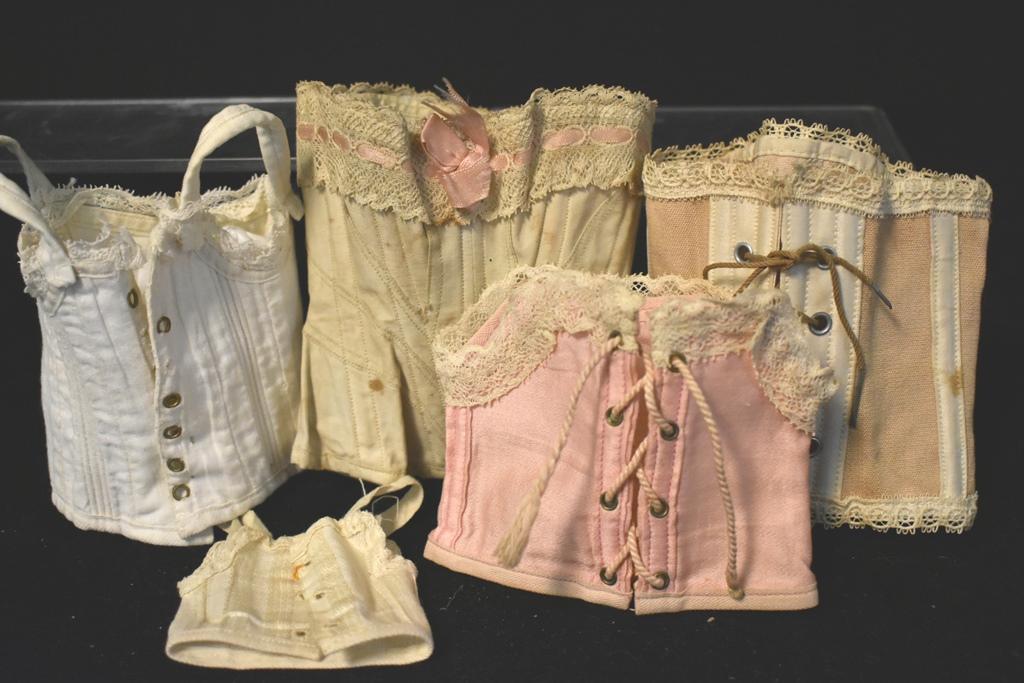 Vintage Doll Corsets: Five Vintage Doll Corsets one has some marks others in good shape, largest 5"