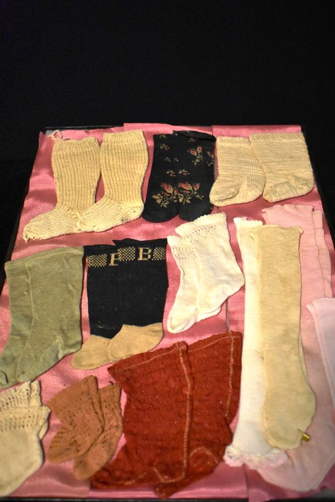 Vintage Doll Stocking Collection: Very Fanciful group of Stocking , 13 pairs one with floral design, one with B knitted on top, Red Lace and others.
