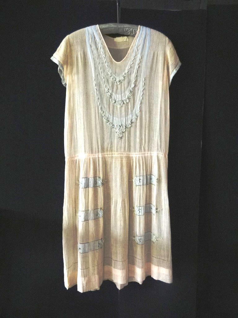 Pink Voile 1920's Day Dress: Made in France, especially for Strawbridge & Clothier labels. Pink voile day dress, 1920's w/dropped waist, pin tacking on front shoulder & across back and sleeves. Sleeves are edged with 1/2" blue vo