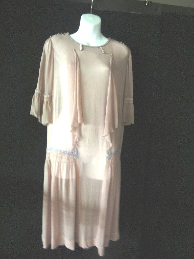 1920's Lilac Chiffon Dress: 1920's lilac chiffon dress, possibly French, but no label. Dropped waist 3/4 length sleeves w/ruffled edge bodice looks like an open jacket w/ruffle over the chest. The dress is opened at the shoulder