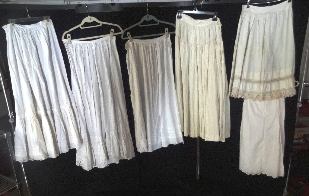 Six Assorted Petticoats: All are cotton, one is plain and one has holes and repairs, the rest have embroidered hems, as found all need refreshing