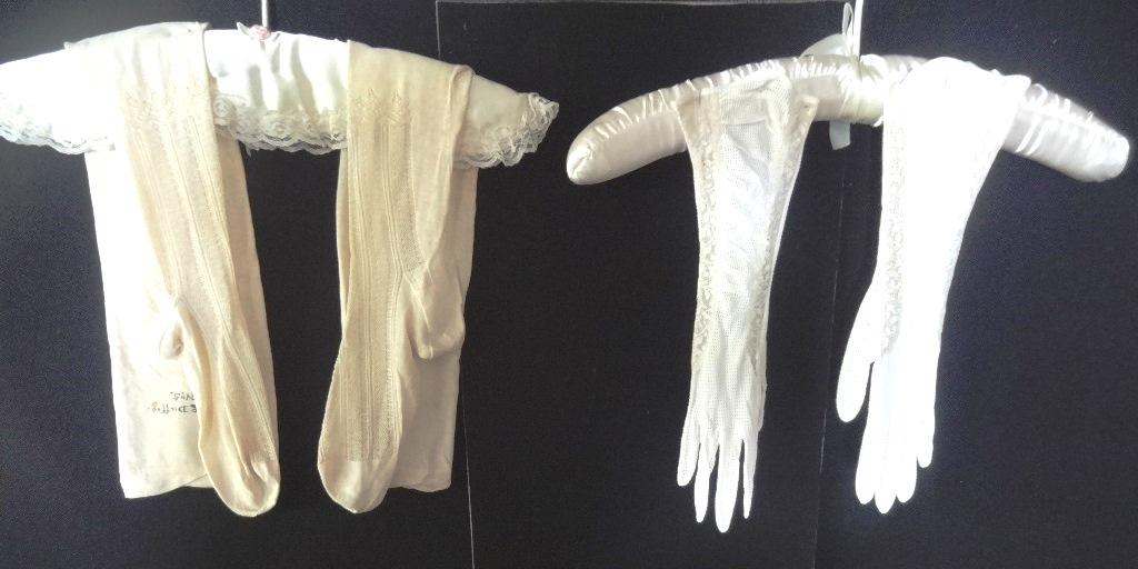 Two Pieces, One Pair Gloves and One Pair Victorian: Almost elbow length gloves, size 7 1/2 by Fawnes, nylon knit w/2 rows of lace on each pair, stocking are a light beige cotton lisle, knitted in the stocking from the toes up to just below the knee, On