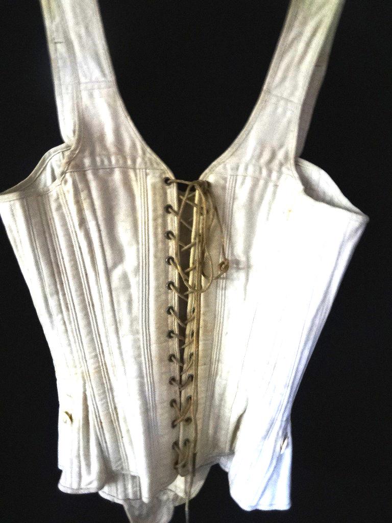 Victorian Corset: Victorian corset, all cotton with standard boning for the style 7 vegetable ivory button for front opening. Button straps the same and each strap has 4 openings to lengthen or shorten for correct fit.