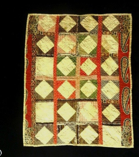 Vintage Dolls Quilt circa Late 1800: Superior Vintage Doll Quilt with very early fabric, hand stitching, in muted Red and Green colors and also some pasteli, back has a few brown spots, front is very good. This Early is difficult to find