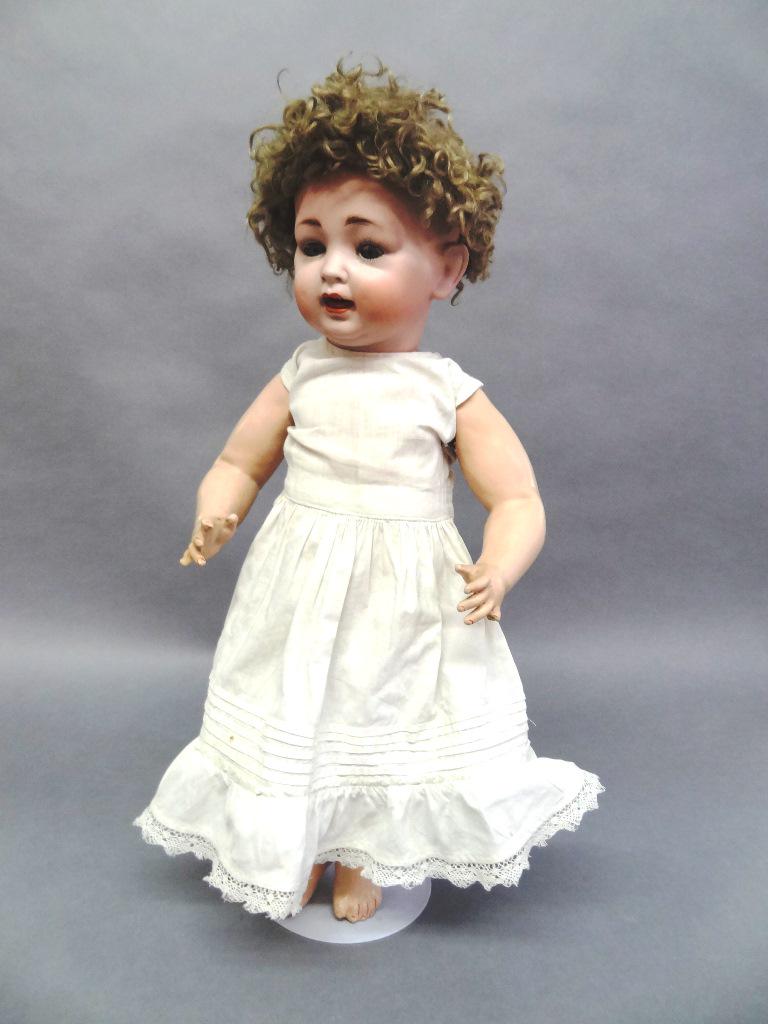 Bisque Doll Kestner #152 21" Baby Doll: Kestner Toddler with open mouth, New Wig Good compositing Body , eyes open and close, glass eyes, ahead might have some repair on eyes, has glue on top of head, Marked #152 . She needs some good care!