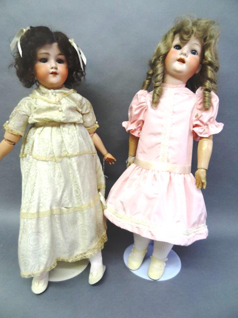 Two Bisque Dolls A&M and Heubach: Two 29" Bisque Dolls A & M 390 and Heubach ,Both dolls have open and shut eyes open mouths', redressed, wigs are glued on and cannot see heads, they are both as is.