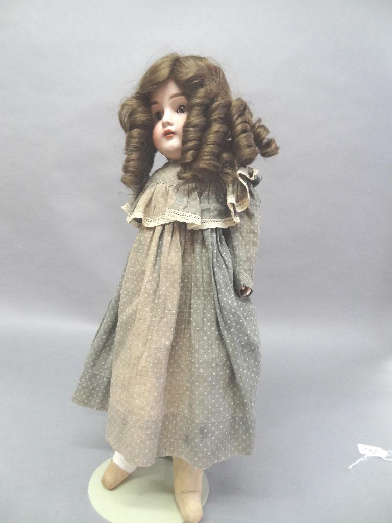 Bisque Kestner #154: Bisque Kestner #154 - 20 1/2", new wig, glared in, open/close eyes, open mouth, gusseted body cloth legs one foot with dome, bisque arms, redressed, beautiful face