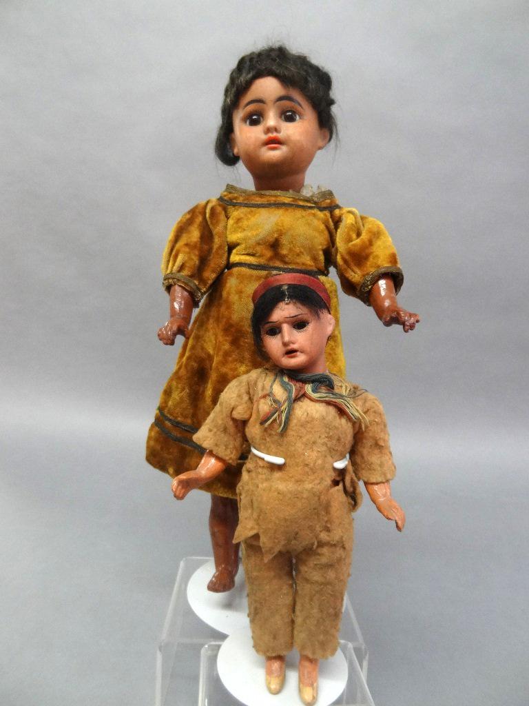 Two Indian Bisque Dolls: 14 1/2" horseshoe mark DEP, 1 good, missing hair, glass eyes, face discoloration, body velvet dress, good body, 8 1/2" bisque Indian, body good, hair w/band on hair, some hair, glass eyes