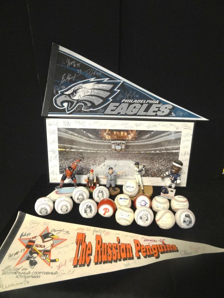 Sports Lot: Core State Center pass, Eagle pendent signed, the Russian Penguins signed Pendant, 15 baseballs, baseball figure, hockey figure, football figure