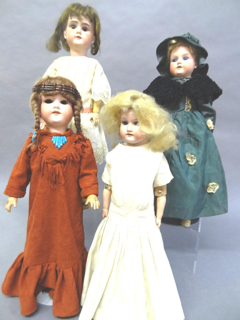 Four A&M Bisque Dolls: 1 - A&M bisque doll 18" 370 DED w/leather body, leather legs, open/close eyes, redressed shoulder head, 2 - A&M 21" Floradora bisque head old wig, open/close eyes, open mouth composition body, redress