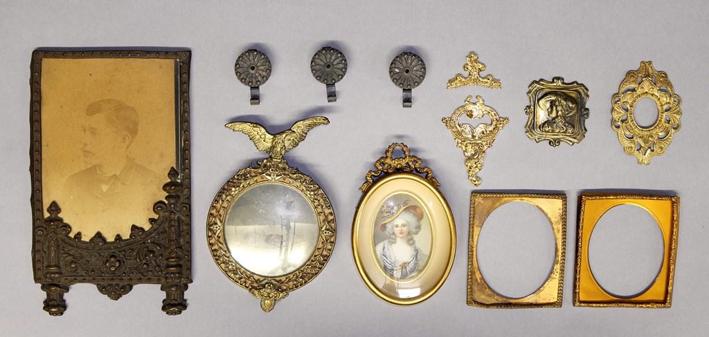 Dollhouse Ormolu Frames & Accessories: Nice assortment of dollhouse frames ranging in age from vintage to antique, large portrait of a Victorian young man in an ornate unplated brass frame 4.5" by 7.75", round bulls eye mirror with ormolu 