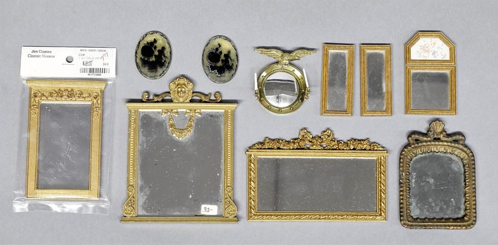 Assortment of Dollhouse Mirrors: Round bulls eye mirror with eagle crest and two sconce arms 1 5/8"W, antique cast metal mirror with shell crest 2.25" by 3.5", pair of oval silhouettes 1.5"H, group of commercial mirrors