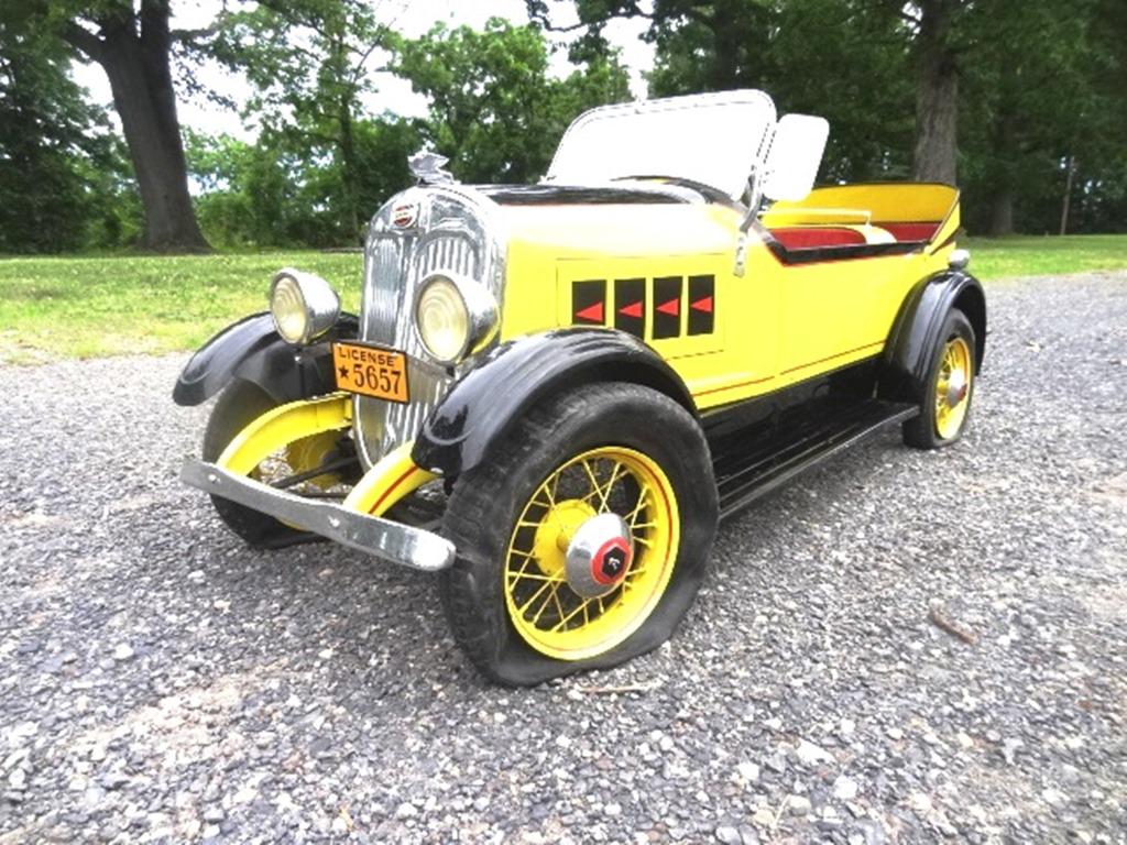 The American National Co. Pedal Car: Pedal car juvenile auto Lincoln black/yellow with red trim 24" (T), 63" (L), 23" (W) made in USA Toledo, OH