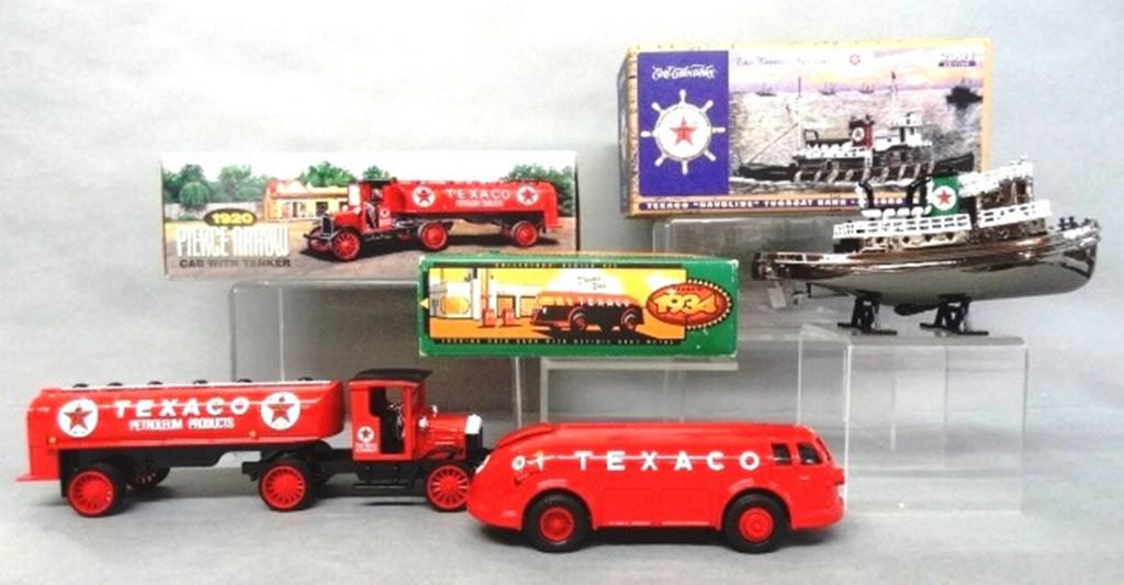 Texaco Tanker, Doodlebug, Tugboat Banks in O/B: Three Ertl die cast vehicles - tanker truck Pierce Arrow cab & tanker 16th in series, Doodlebug Diamond T tanker truck 11th in series, Tugboat "Texaco Havoline" 2nd in series 12" X 4" X 3 1/2"