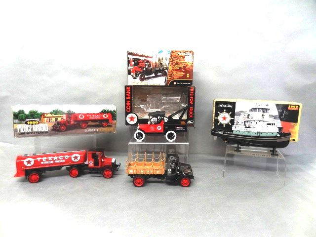 Texaco Trucks and Tugboat Banks in O/B: Four die cast Texaco vehicles - 1920 Pierce Arrow tanker series 16, 1918 Mack AC Bulldog flat bed truck, Gearbox 1911 tow truck, Texaco Havoline tugboat 1st in series
