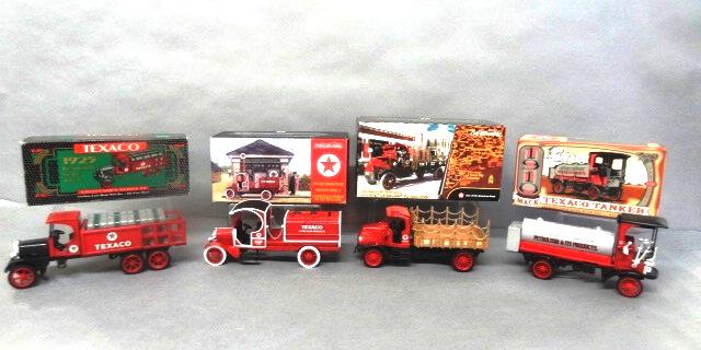 Texaco Truck Banks in O/B: Texaco Ertl die cast banks, 1919 GMC tanker series 17, 1918 Mack AC Bulldog flatbed, 1925 Kenworth stake series 9, 1910 Mack series 12, - 9" x 5" x 4"