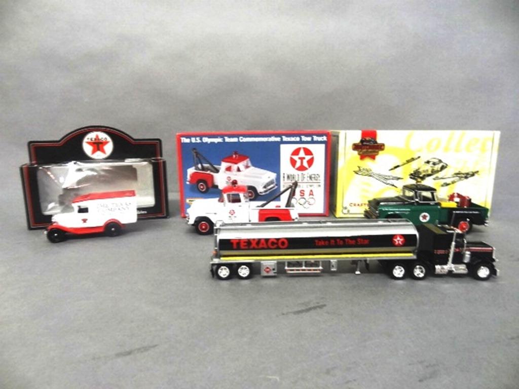 Texaco Die Cast Trucks in O/B: Texaco 95th anniversary truck (Ledo), tractor trailer tanker (Matchbox), U.S. Olympic team tow truck (Matchbox), 1955 Chevy Service truck (Matchbox) 7" x 4" x 3"