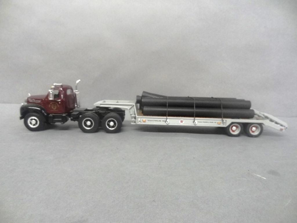 Die Cast Mack Truck: First Gear 1960 Model B-61 Mack flat bed tractor trailer "Ray Meyer Fossils" 17" x 3 1/2" x 3"
