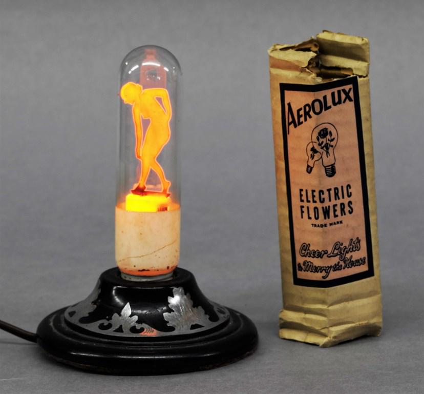 Vintage Aerolux Nude Woman Bulb: Vintage Aerolux electric bulb with metal naked woman on top of filament, with original packaging, 5.5"H, lamp not included