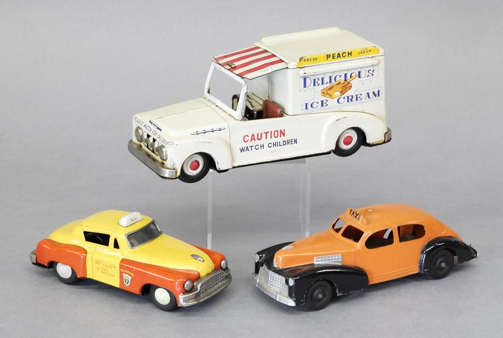Vintage Ice Cream Truck & Cars: Japanese litho tin Ford Delicious Ice Cream Truck friction toy, canopy over driver slides back into roof, 8"L, Hubley die-cast taxi with nice original paint and rubber tires 7"L, Japanese tin litho fr