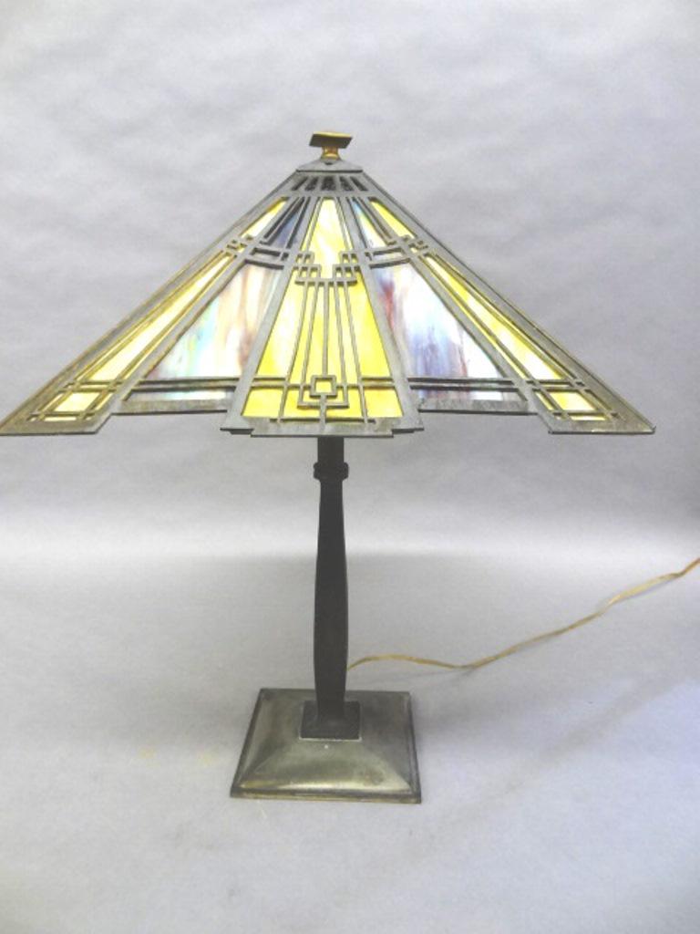 Vintage Art Deco Stained Glass Lamp: Vintage art deco table lamp, patinated brass base and shade with a geometric pattern, four sockets with older replacement wiring, 23"H, 16"W