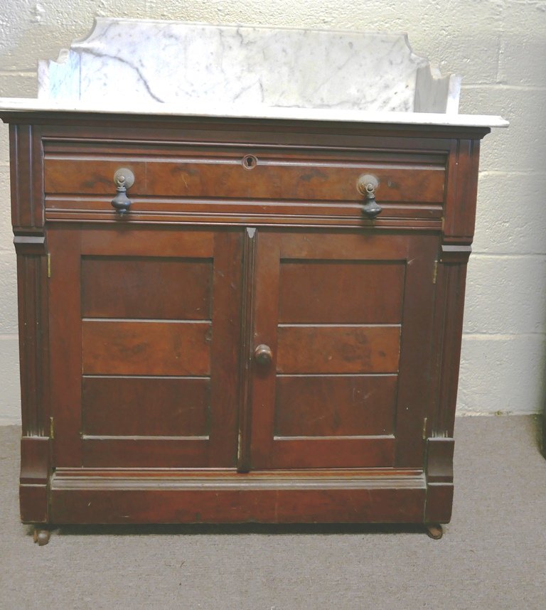 Victorian Marble Top Wash Stand: Antique marble top wash stand, walnut case with highly figured mahogany veneer on front, original pulls, casters and lock, old refinish presents well, 32"W, 15.5"D, 37.5"H
