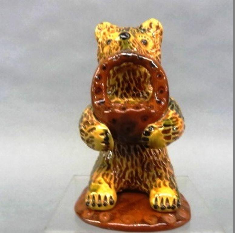 Breininger Redware Seated Bear Sculpture: Lester Breininger redware figural sculpture of a seated bear holding a basket of apples, signed and dated 1999 on bottom, 4.75"H