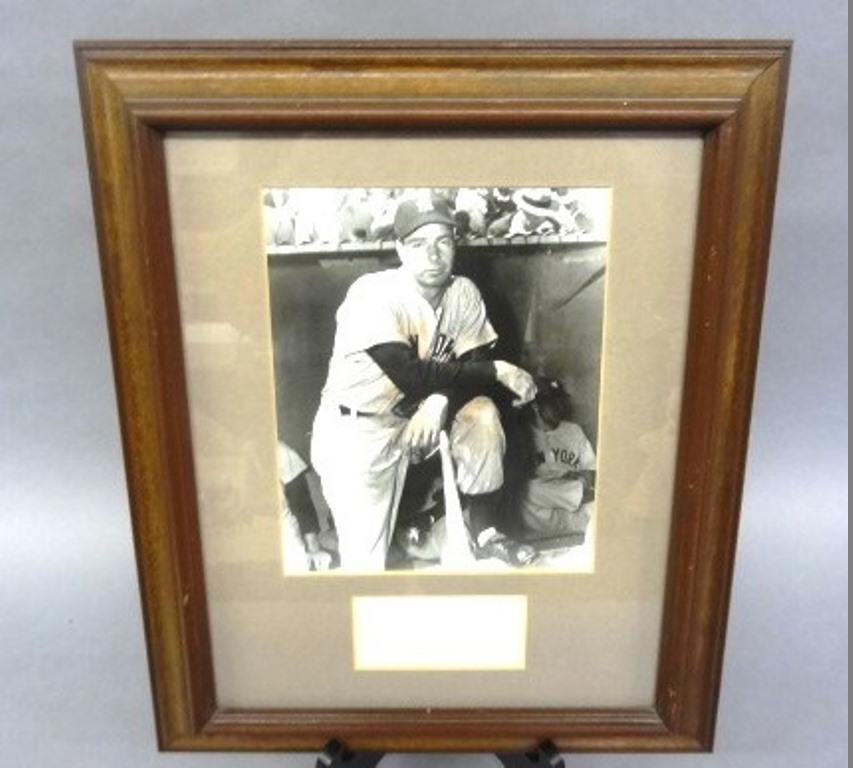 Joe DiMaggio Signature & Photo: Joe DiMaggio cut signature, sight size 2" by 4" nicely matted and framed with a press photo, overall 14" by 17"