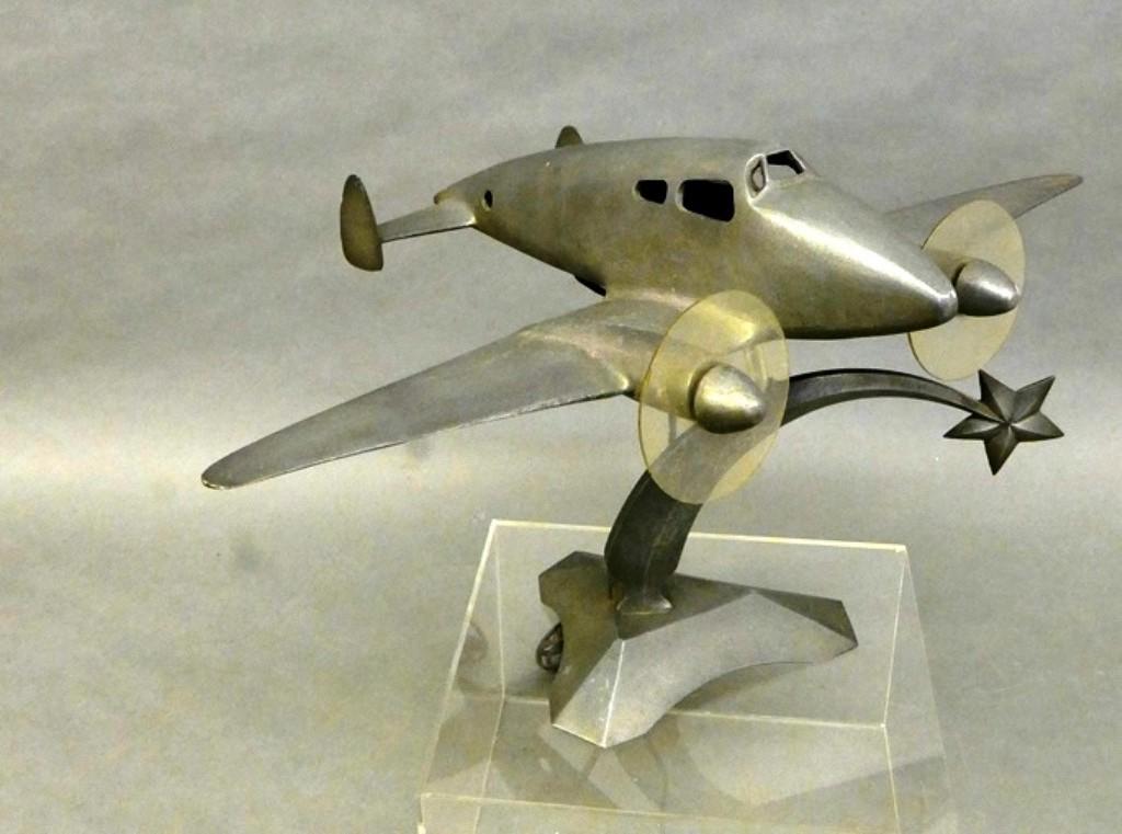 Vintage Aluminum Airplane Lamp: Vintage Art Deco aluminum table lamp, plane flying over a shooting star, two plastic propellers, 12"H, 21.5" wingspan, 15.5"D