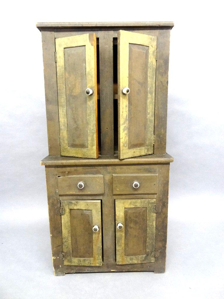 Antique Child's Step back Cupboard: Antique child's painted softwood cupboard with ceramic handles, 29.5"H, 14.75"W, 6.5"D
