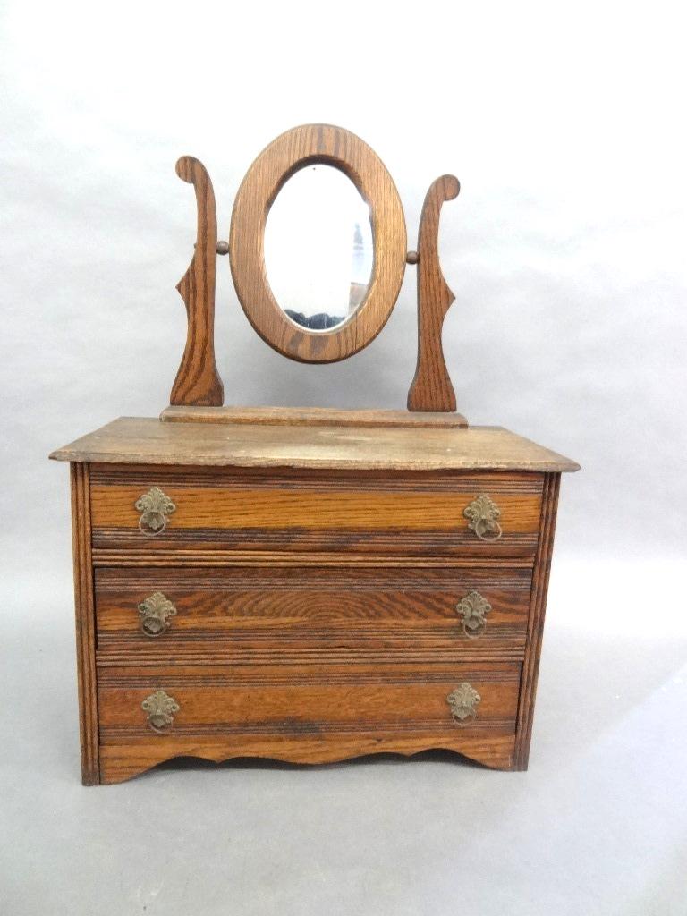 Antique Child: Antique child's oak three drawer dresser with original ormolu pull and mirror, 17.5"W, 24.75"H, 8.5"D