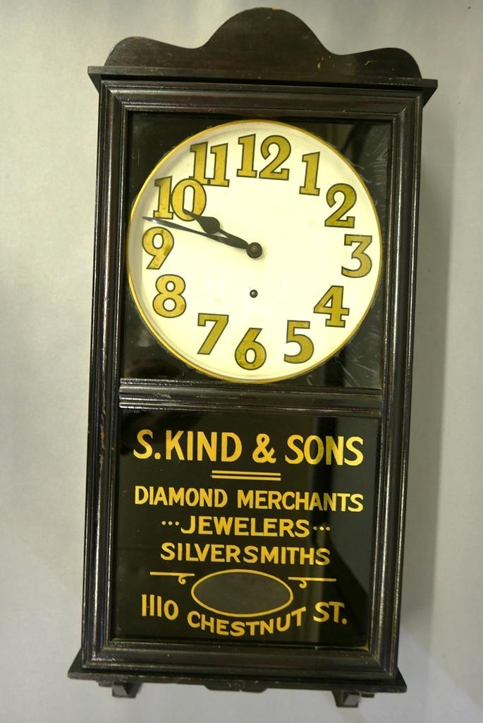 Antique New Haven Advertising Clock: New Haven wall clock with eight day movement, tin dial, glass advertising panel, includes pendulum and key, 35"H, 16"W, 5"D