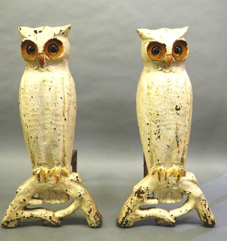 P.S. & W. Cast Iron Owl Andirons: Circa late 1800's cast iron own andirons with glass eyes, marked P.S. & W. 3000A for Peck Stow and Wilcox tool makers, removable dogs, 21"H, 18"D