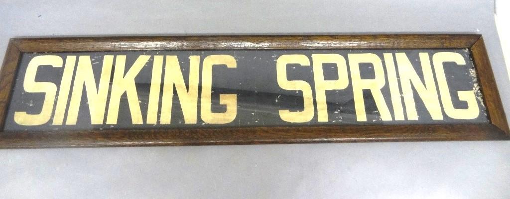 Sinking Spring Pa. Canvas Trolley Sign: Antique painted canvas "Sinking Springs" sign mounted in an oak frame, 44" by 9.25", replaced cardboard backing on frame with hand written notation "Sinking Spring 1917 Trolley"