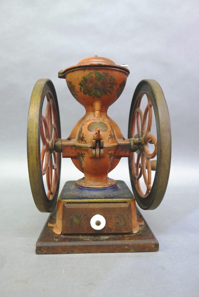 Antique Enterprise Coffee Grinder: Antique store coffee grinder, double wheel with a single handle, original red paint with painted scrolls and flowers, original ceramic knobs, mounted on wood base, 14.5"H, 11.5"W, 10.75"D wheels