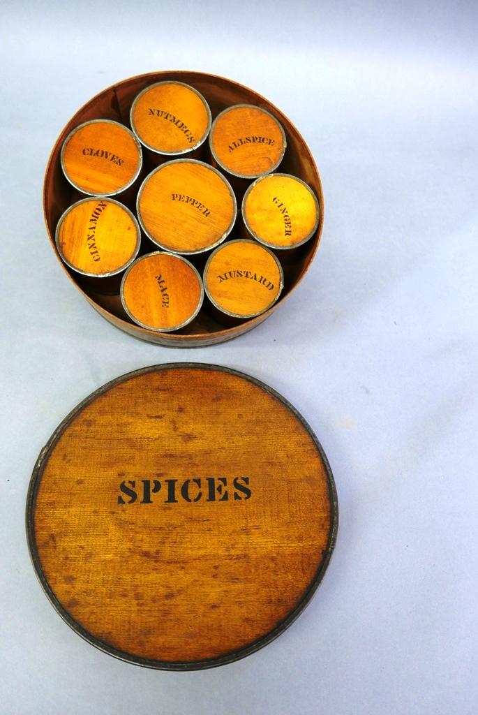 Round Spice Box With Eight Individual Containers: Antique wood band box with metal edges 9.25"D, 3.25"H containing eight original small containers with matching stenciling