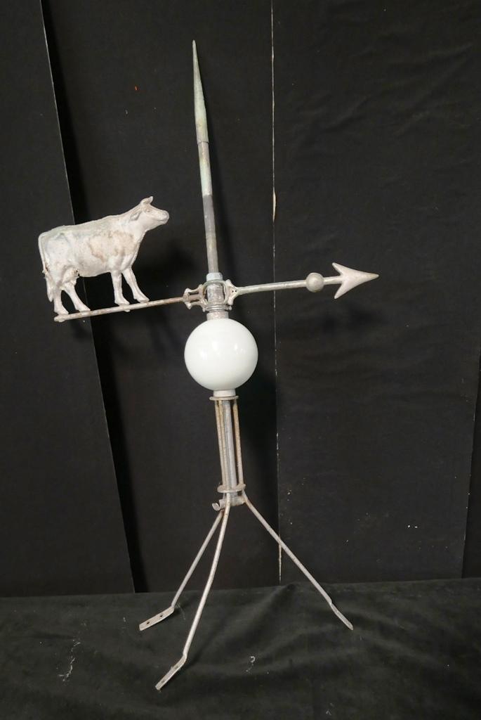 Antique Cow Lightning Rod Weathervane: Antique three dimensional zinc cow 9.5"L on weather van mounted on a lightning rod with a blown white glass ball, 38"H
