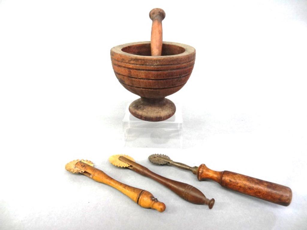 Three Pie Crimpers & Mortar: Three antique pie crimpers, two with carved bone wheels and one with a cast brass wheel stamped Germany 6.25"L, small primitive turned mortar 4"W, 3.5"H with pestle