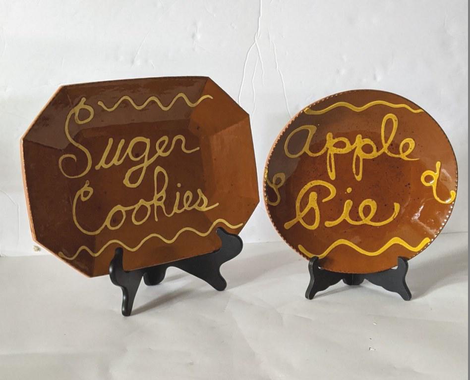 Breininger Sugar Cookies Tray & Apple Pie Dish: Lester Breininger redware rectangular tray with clipped corner and slip decoration, 10.5" by 14", signed and dated 2010 on reverse, round redware dish with apple pie in slip decoration, toggle decorat