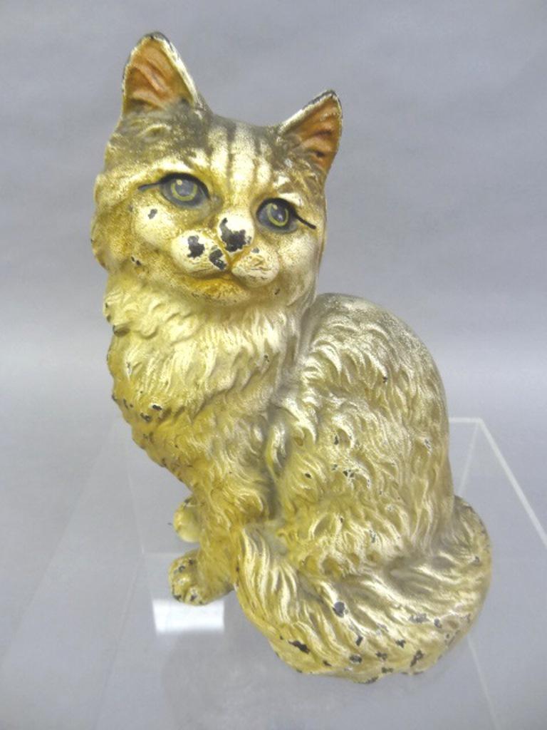 Hubley Persian Cat Doorstop: Early 1900's cast iron full bodied Persian cat with original paint, marked "Hubley 302", 9"H