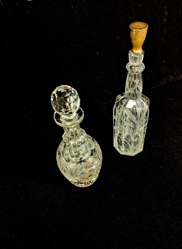 Two Antique Cut Glass Decanters: Antique cut glass bulbous decanter with faceted stopper 12"H, antique fluted decanter with cut wheat decoration and sterling silver over glass stopper with Birmingham England hallmarks 14"H