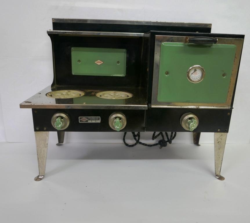 Empire Metal Ware Child's Stove: Child's electric stove circa 1920's by Empire Metal Ware Corp., two electric burners and an oven with thermometer, patent 1924, black and green enamel with chrome trim, 21"W, 17"H, 10.25"D