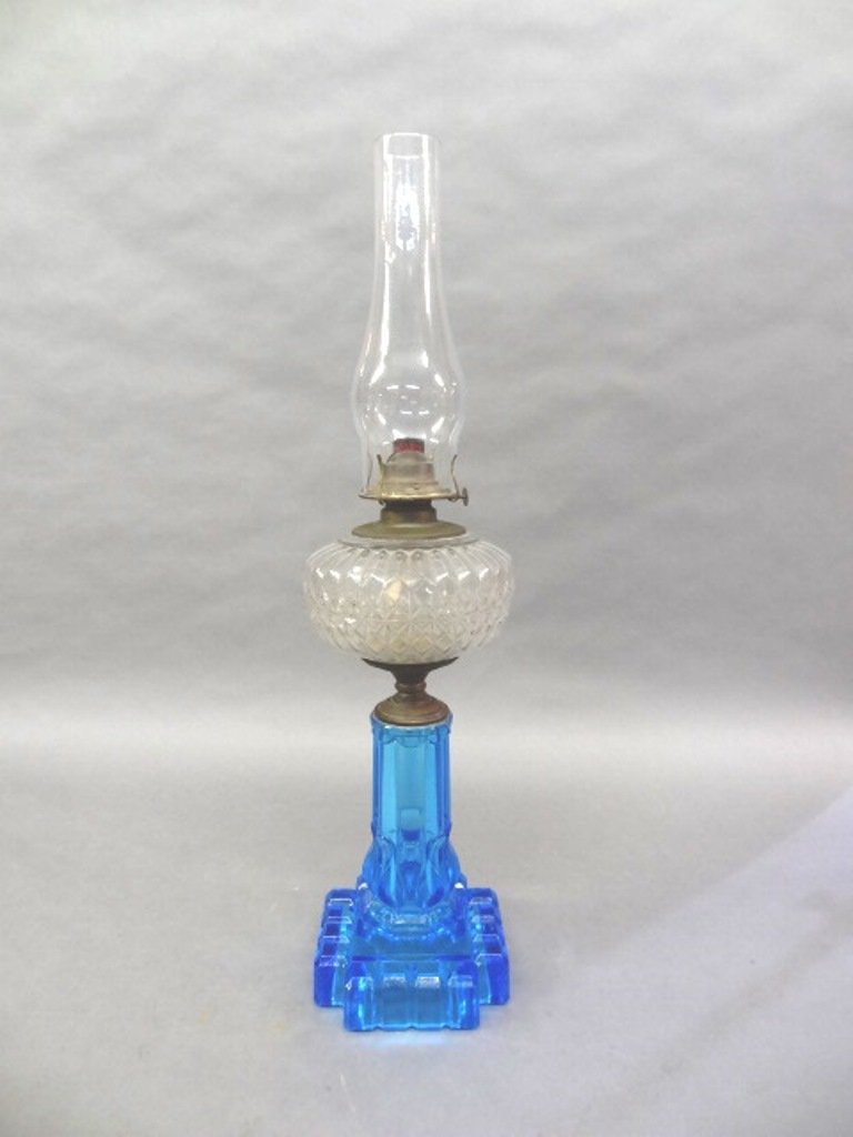 Antique Blue & Clear Kerosene Lamp: Antique kerosene lamp with light blue glass base, clear reservoir and chimney, 27"H overall