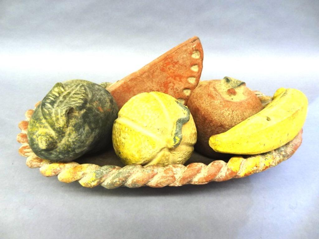 Folksy Earthenware Basket Of Fruit: Primitive earthenware oval bowl with rope twist border, 12" by 19.5" by 4"H, comes complete with set of fruit, pear, melon, apple, banana and slice of watermelon