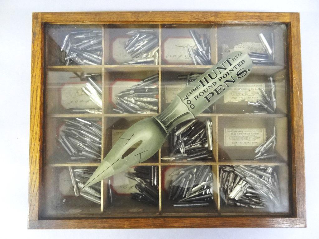 Antique Hunt's Pens Store Display Case: Antique wood divided countertop display case with glass lid and pull out drawer, advertising label under glass, includes a nice assortment of pen nibs, 12.5"W, 10"D, 2"H