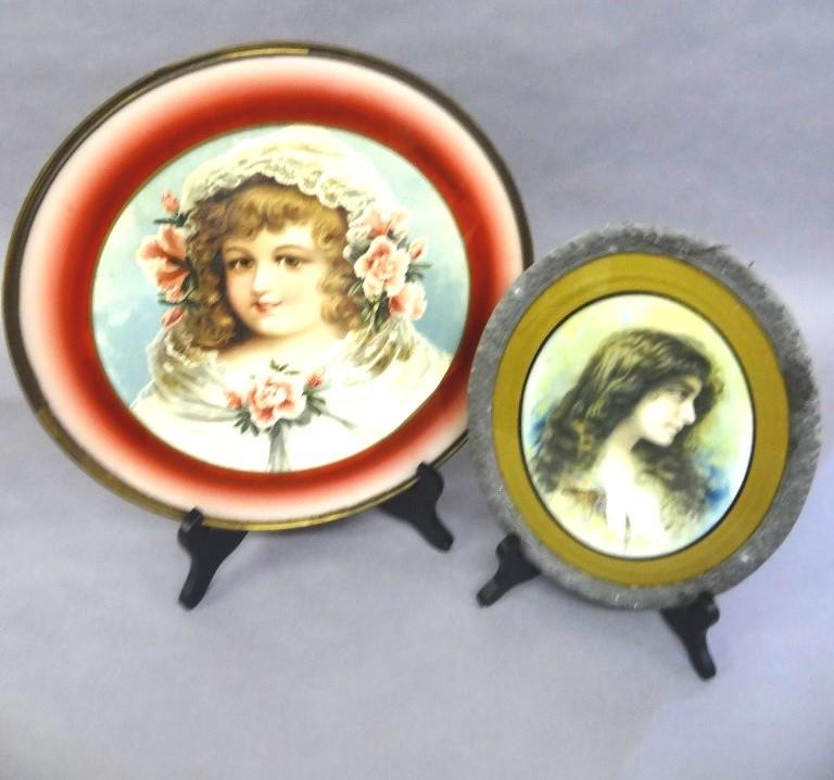 Two Antique Stovepipe Covers: Oval stovepipe cover, printed portrait of a young lady behind glass, glass has black and gold painted matting, tin frame with embossed floral design, 10"W, 12.5"H, round stovepipe cover, printed portr