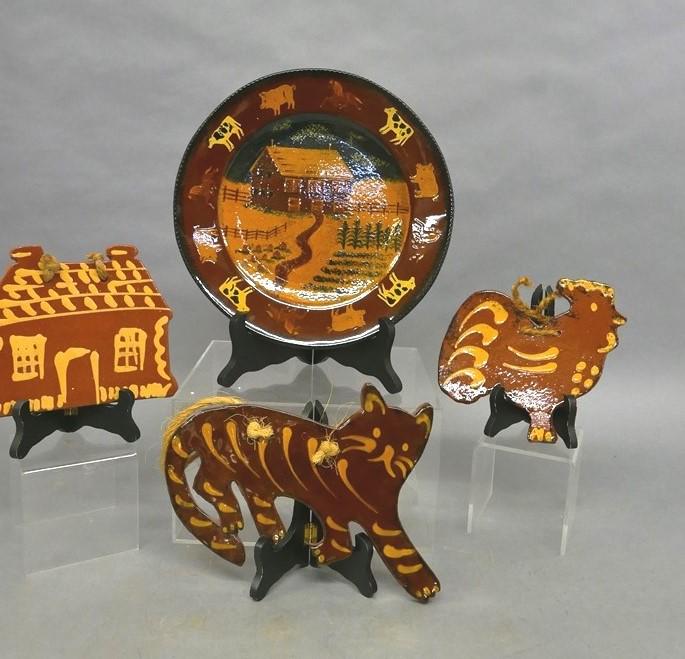 Foltz Pottery Plate, Cat, Rooster and House: Three Foltz Pottery redware hanging figural plaques, cat 11"L, rooster 7"L, house 7.25"W, plate slip decorated with farmhouse and livestock 11.5"D