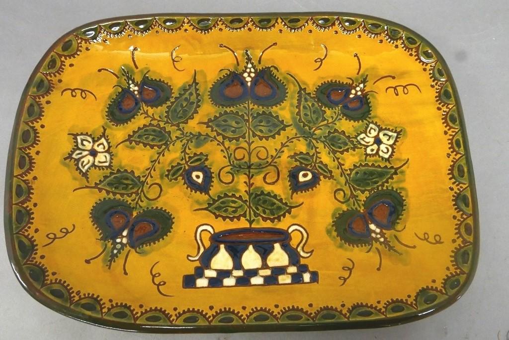 Large Redware Platter: Large redware platter with basket of flowers design, polychrome slip and sgraffito decoration, signed illegibly on reverse [iSx?], 11.25" by 15.5" by 2"H
