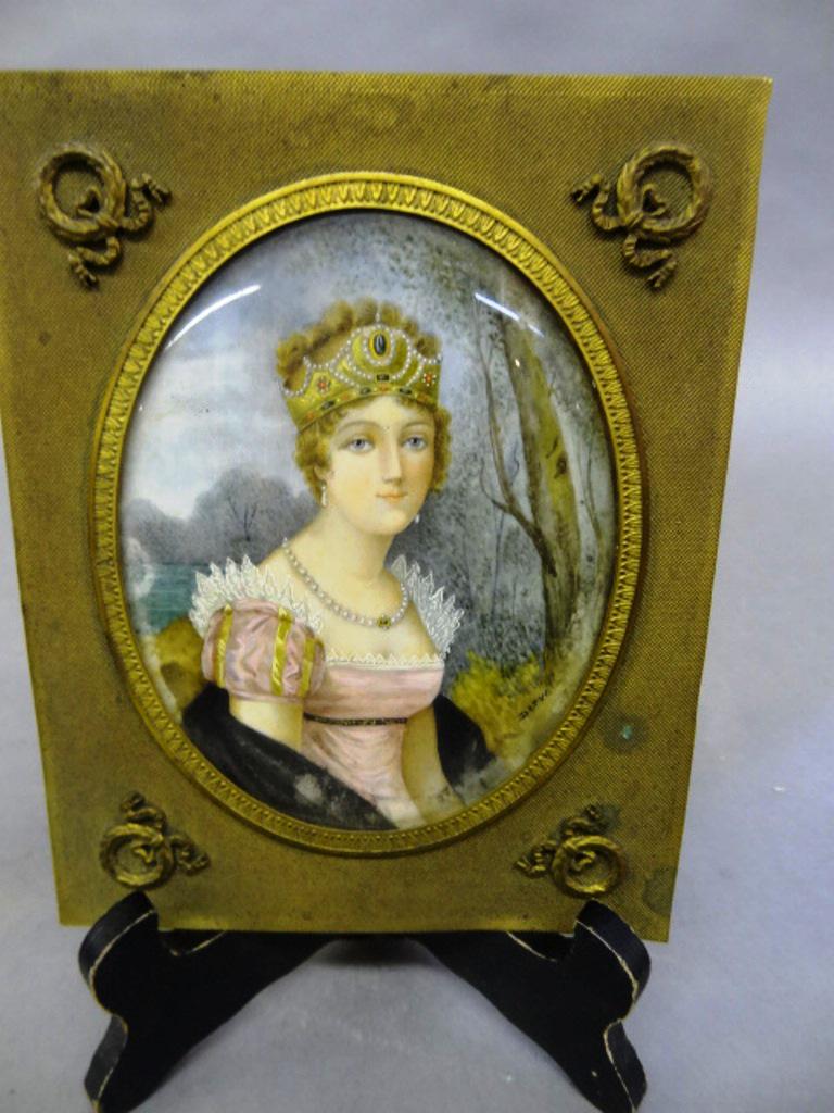 Antique Portrait of Marie Louise: Antique painting on bone portrait mounted in a brass frame with ormolu mounts, backing signed Imperatrice Marie Louise, 5" by 6.5"